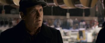 Movie still from “Dear John” (2010), directed by Lasse Hallström – An older man wearing a hat and a coat; Close Up shot, Over the shoulder angle