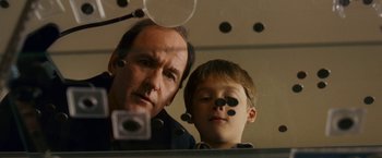 Movie still from “Dear John” (2010), directed by Lasse Hallström – A man and a boy are looking at a mirror; Close Up shot, Over the shoulder angle