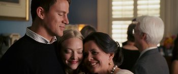 Movie still from “Dear John” (2010), directed by Lasse Hallström – Two women and a man smiling for the camera; Close Up shot, Low angle