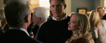 Movie still from “Dear John” (2010), directed by Lasse Hallström – A man and a woman standing next to each other in a room; Close Up shot, Over the shoulder angle