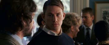 Movie still from “Dear John” (2010), directed by Lasse Hallström – A man in a black sweater and he is looking at the camera; Close Up shot, Over the shoulder angle