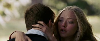 Movie still from “Dear John” (2010), directed by Lasse Hallström – A young man and a young woman are hugging; Close Up shot, Over the shoulder angle