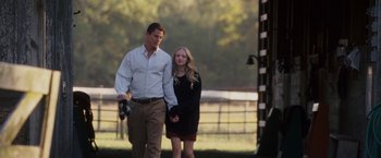 Movie still from “Dear John” (2010), directed by Lasse Hallström – A man and a woman holding hands while walking outside; Wide shot, Low angle