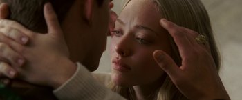 Movie still from “Dear John” (2010), directed by Lasse Hallström – A young man touching a woman's face with his hand; Extreme Close Up shot, Over the shoulder angle