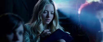 Movie still from “Dear John” (2010), directed by Lasse Hallström – A beautiful young lady writing in a notebook; Close Up shot, Over the shoulder angle