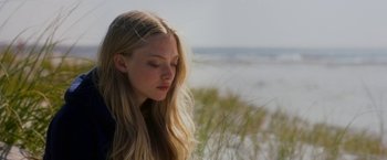 Movie still from “Dear John” (2010), directed by Lasse Hallström – A beautiful young woman with long blonde hair and eyes closed; Close Up shot, Over the shoulder angle