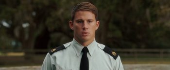 Movie still from “Dear John” (2010), directed by Lasse Hallström – A person wearing a uniform; Close Up shot, Over the shoulder angle