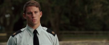 Movie still from “Dear John” (2010), directed by Lasse Hallström – A man wearing a uniform and a neck tie; Close Up shot, Over the shoulder angle