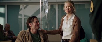 Movie still from “Dear John” (2010), directed by Lasse Hallström – A man and a woman standing next to each other in a room; Medium shot, Over the shoulder angle