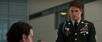 Movie still from “Dear John” (2010), directed by Lasse Hallström – A man in a military uniform standing next to another man; Close Up shot, Over the shoulder angle
