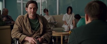 Movie still from “Dear John” (2010), directed by Lasse Hallström – A man sitting in a chair in front of a group of people; Medium shot, High angle