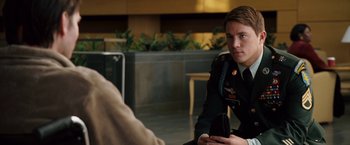 Movie still from “Dear John” (2010), directed by Lasse Hallström – A man in a military uniform sitting in front of another man; Medium shot, Over the shoulder angle