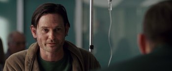 Movie still from “Dear John” (2010), directed by Lasse Hallström – A person sitting in front of a window; Close Up shot, Over the shoulder angle