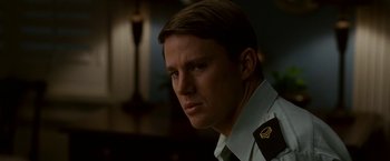 Movie still from “Dear John” (2010), directed by Lasse Hallström – A person wearing a military uniform; Close Up shot, Over the shoulder angle
