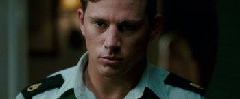 Movie still from “Dear John” (2010), directed by Lasse Hallström – A person wearing a shirt and tie; Close Up shot, Over the shoulder angle