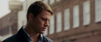 Movie still from “Dear John” (2010), directed by Lasse Hallström – A person looking down at his face; Close Up shot, Low angle