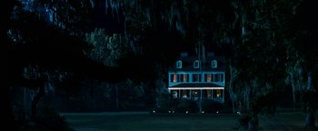 Movie still from “Dear John” (2010), directed by Lasse Hallström – A large house in the dark with lights on the windows; Extreme Wide shot, Low angle