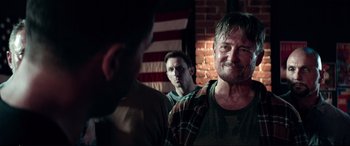 Movie still from “Debt Collectors” (2020), directed by Jesse V. Johnson – Two men are looking at each other in the mirror; Close Up shot, Over the shoulder angle