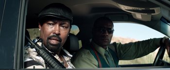 Movie still from “Debt Collectors” (2020), directed by Jesse V. Johnson – Two men sitting in the back seat of a car; Close Up shot, Over the shoulder angle