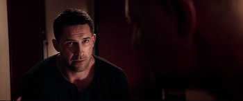 Movie still from “Debt Collectors” (2020), directed by Jesse V. Johnson – A person wearing a black t - shirt; Close Up shot, Over the shoulder angle