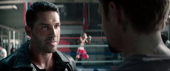 Movie still from “Debt Collectors” (2020), directed by Jesse V. Johnson – Two men in a boxing ring talking to each other; Close Up shot, Over the shoulder angle