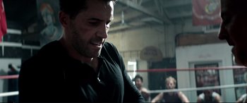 Movie still from “Debt Collectors” (2020), directed by Jesse V. Johnson – A person in a boxing ring; Close Up shot, Over the shoulder angle