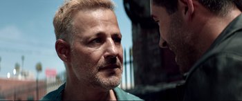 Movie still from “Debt Collectors” (2020), directed by Jesse V. Johnson – A man with a goatee is looking at another man with a goatee; Close Up shot, Over the shoulder angle