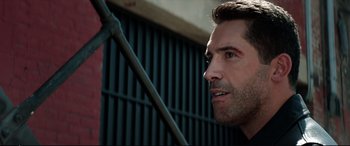 Movie still from “Debt Collectors” (2020), directed by Jesse V. Johnson – A person holding a pole; Close Up shot, Over the shoulder angle