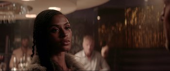 Movie still from “Debt Collectors” (2020), directed by Jesse V. Johnson – A person in a room near a wall; Close Up shot, Over the shoulder angle