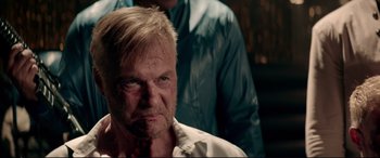 Movie still from “Debt Collectors” (2020), directed by Jesse V. Johnson – A person with a shirt on; Close Up shot, Over the shoulder angle