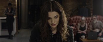 Movie still from “Disobedience” (2017), directed by Sebastián Lelio – A person with long brown hair; Close Up shot, High angle