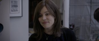 Movie still from “Disobedience” (2017), directed by Sebastián Lelio – A person wearing a black shirt; Close Up shot, Over the shoulder angle