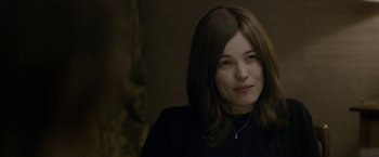 Movie still from “Disobedience” (2017), directed by Sebastián Lelio – A person wearing a black shirt; Close Up shot, Over the shoulder angle
