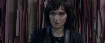 Movie still from “Disobedience” (2017), directed by Sebastián Lelio – A person wearing a jacket; Close Up shot, Over the shoulder angle