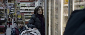 Movie still from “Disobedience” (2017), directed by Sebastián Lelio – A woman standing in front of an open refrigerator; Close Up shot, Over the shoulder angle