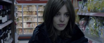 Movie still from “Disobedience” (2017), directed by Sebastián Lelio – A person with long hair; Close Up shot, Over the shoulder angle