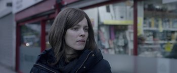 Movie still from “Disobedience” (2017), directed by Sebastián Lelio – A person wearing a jacket; Close Up shot, Over the shoulder angle