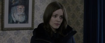 Movie still from “Disobedience” (2017), directed by Sebastián Lelio – A person wearing a jacket; Close Up shot, Over the shoulder angle