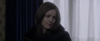 Movie still from “Disobedience” (2017), directed by Sebastián Lelio – A person wearing a jacket; Close Up shot, Over the shoulder angle