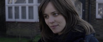Movie still from “Disobedience” (2017), directed by Sebastián Lelio – A person with long hair; Close Up shot, Over the shoulder angle