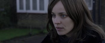 Movie still from “Disobedience” (2017), directed by Sebastián Lelio – A person with long hair; Close Up shot, Over the shoulder angle