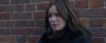 Movie still from “Disobedience” (2017), directed by Sebastián Lelio – A person with long hair; Close Up shot, Over the shoulder angle