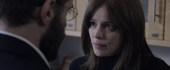 Movie still from “Disobedience” (2017), directed by Sebastián Lelio – A man and a woman looking at one another; Close Up shot, Over the shoulder angle