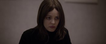 Movie still from “Disobedience” (2017), directed by Sebastián Lelio – A person with long hair; Close Up shot, Over the shoulder angle