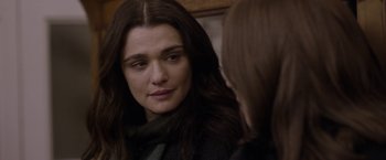 Movie still from “Disobedience” (2017), directed by Sebastián Lelio – A person looking in a mirror; Close Up shot, Over the shoulder angle