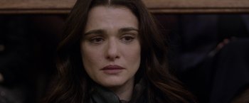 Movie still from “Disobedience” (2017), directed by Sebastián Lelio – A person with long brown hair; Close Up shot, Over the shoulder angle