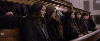 Movie still from “Disobedience” (2017), directed by Sebastián Lelio – A couple of women sitting next to each other on a bench; Medium shot, Over the shoulder angle