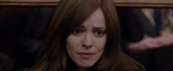 Movie still from “Disobedience” (2017), directed by Sebastián Lelio – A woman's face with brown hair; Close Up shot, Low angle