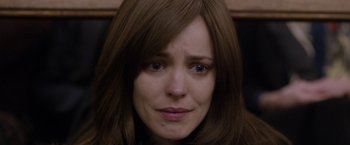 Movie still from “Disobedience” (2017), directed by Sebastián Lelio – A person with long brown hair; Close Up shot, Over the shoulder angle
