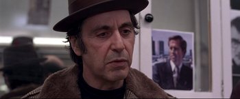 Movie still from “Donnie Brasco” (1997), directed by Mike Newell – Al pacino wearing a hat; Close Up shot, Over the shoulder angle